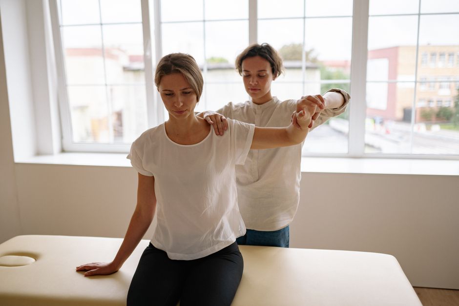 A therapist treating a patient in a modern clinic